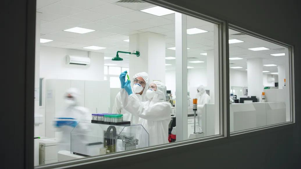 Scientists Hazmat Suits Laboratory Vials