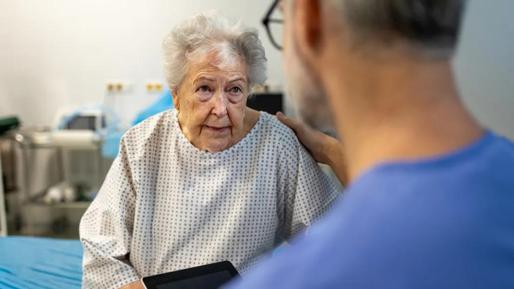 Elderly woman in hospital with provider