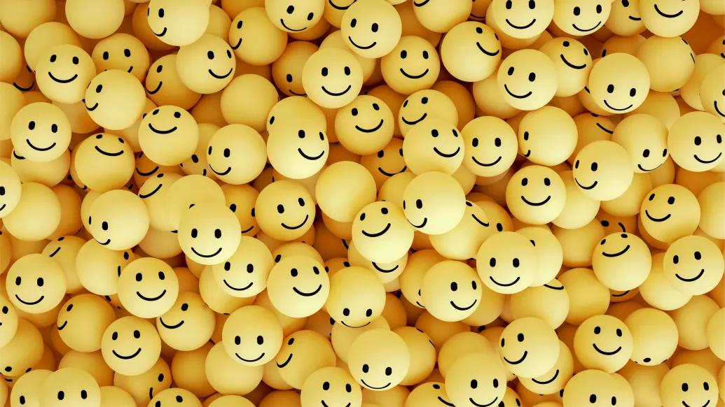 hundreds of yellow smiley face balls