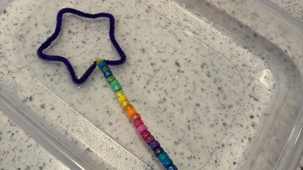 star-shaped wand craft sits in bubble solution