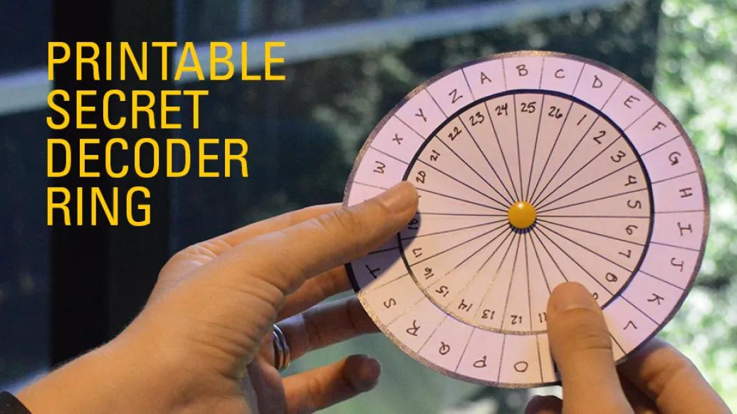 child holds paper circle secret message decoder wheel