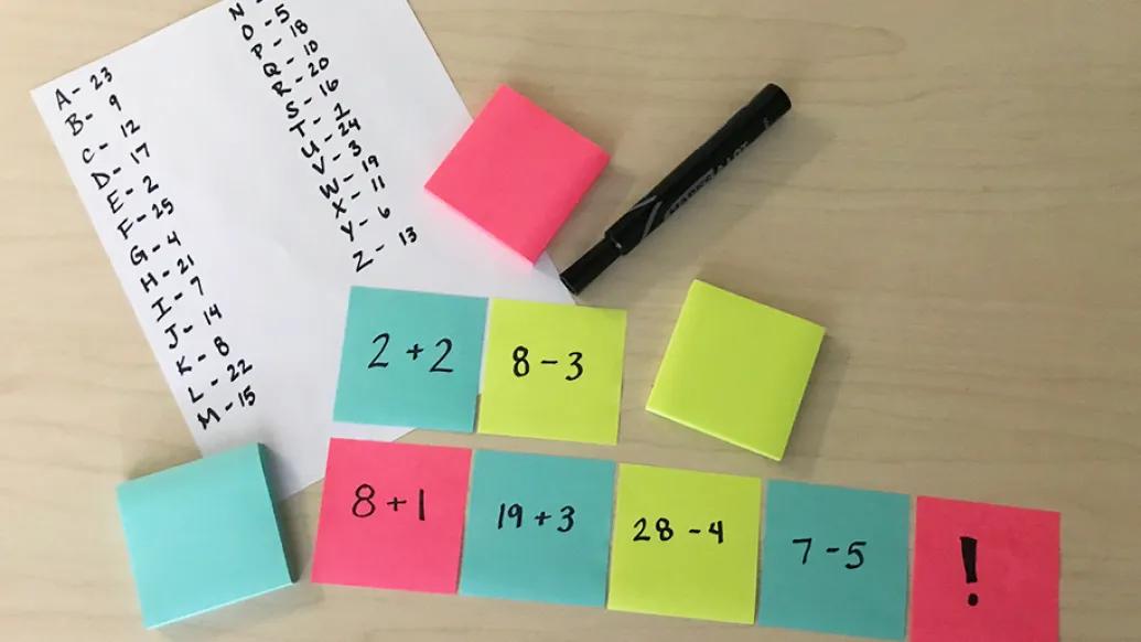 colorful post-its with math equations and decoder answer key