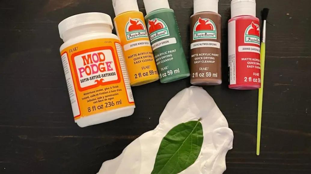 Different color clays in plastic bottles.