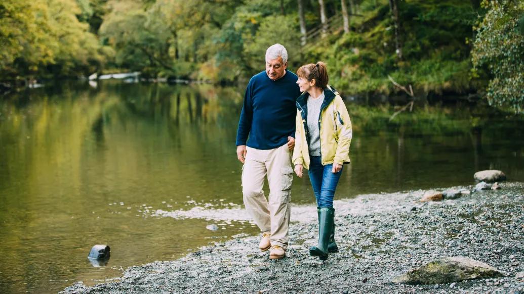 couple walking by the water