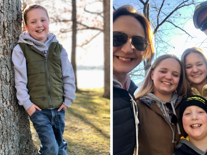 10 year old boy leaning against tree and posing with his mom and sisters outside