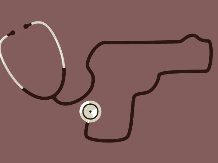 grey and black stethoscope with dark brown background 