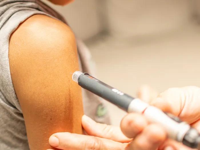 shot in arm patient rolled up sleeve