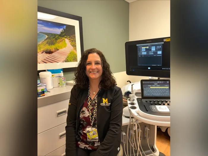 woman standing smiling in doctor's office