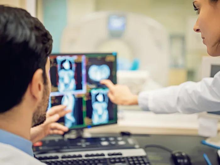 doctors pointing at screen