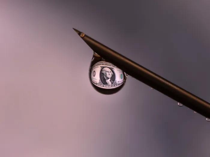 water droplet with money in it