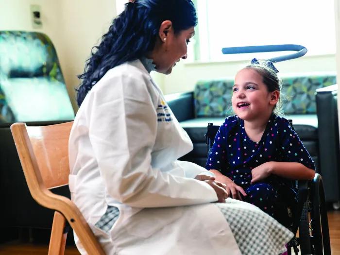doctor sitting with patient in room