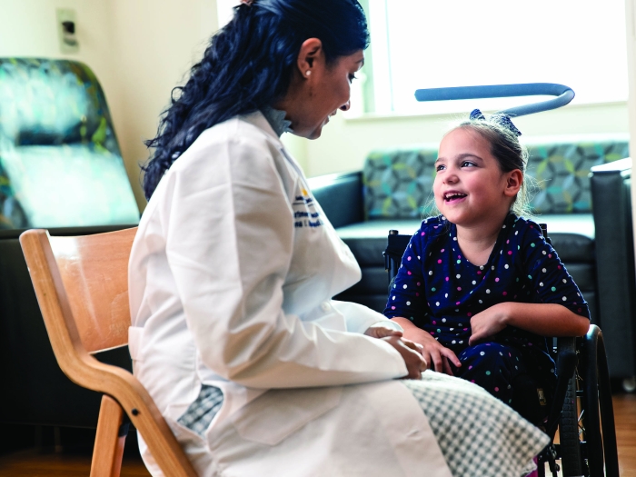 doctor sitting with patient in room