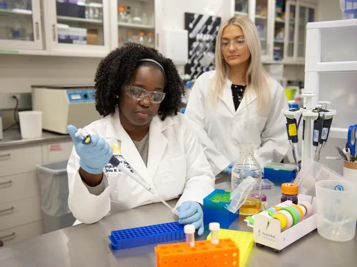 Two scientists conducting research in a lab.