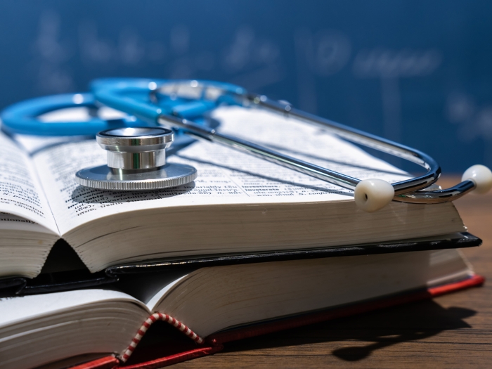 book with stethoscope on it 