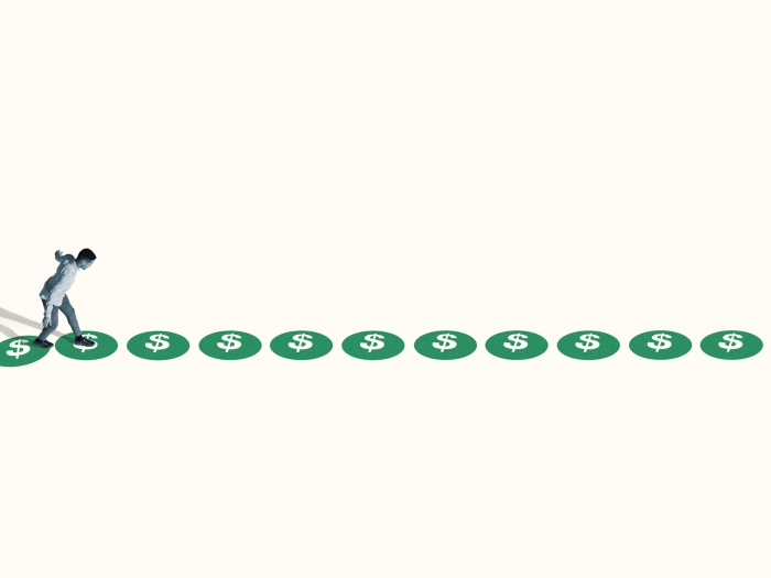 person walking on green circles far away in white space