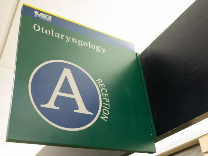 medical sign in green with A symbol on it