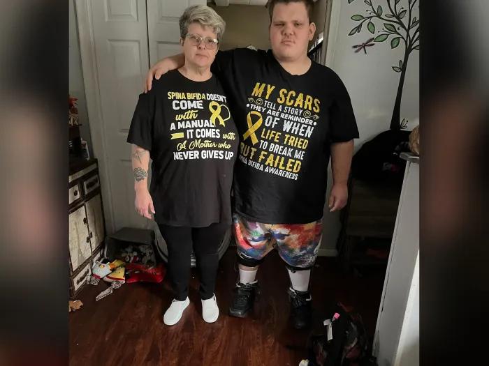 mom and son wearing matching shirts about the disease