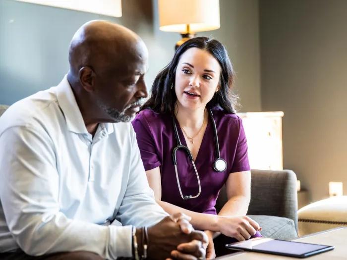 Black patient consults with white nurse
