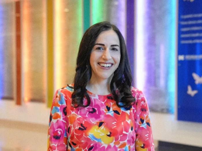 woman smiling colorful background 