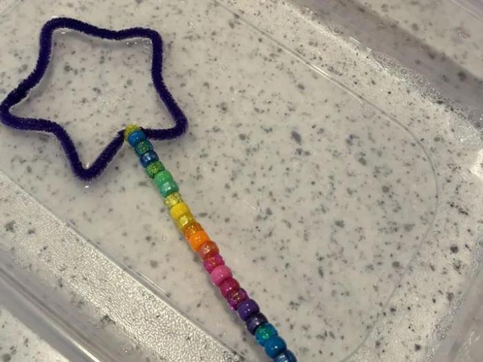 star-shaped wand craft sits in bubble solution