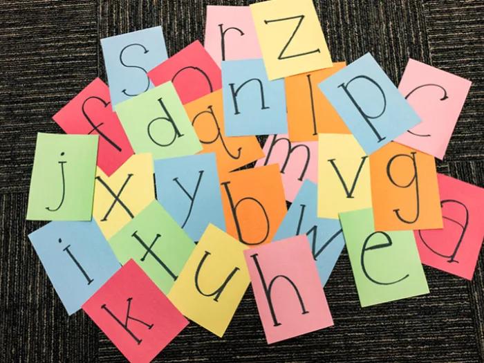 Squares of colored paper with letters