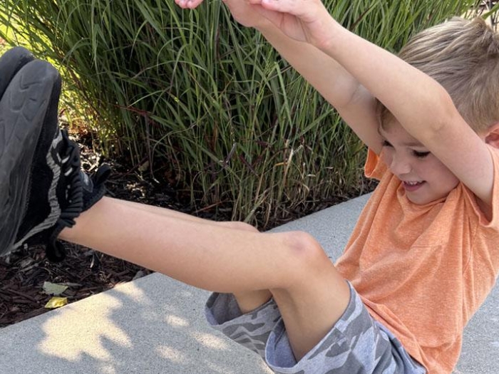 Child doing a yoga movement