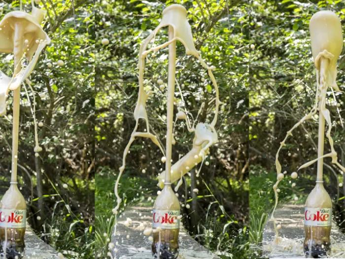 soda explodes out of a diet coke bottle during experiment
