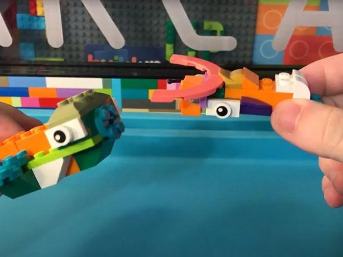 Child playing with assembled legos
