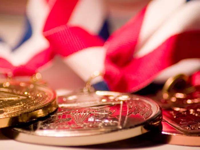 close=up of gold medals on lanyards