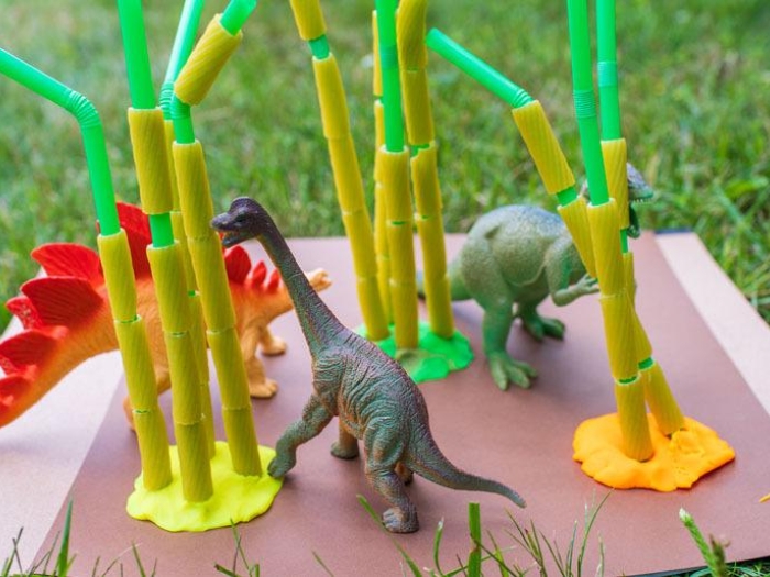 Straws in pasta, dinosaur figures