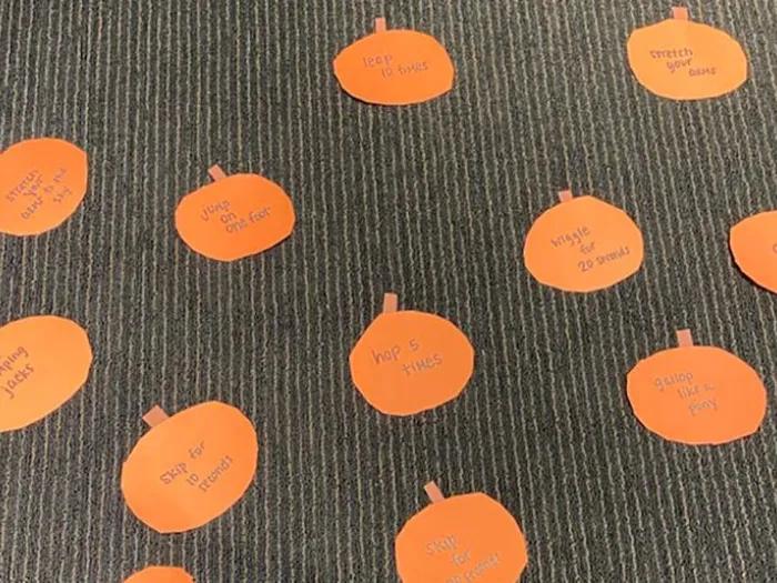Orange paper pumpkins on floor