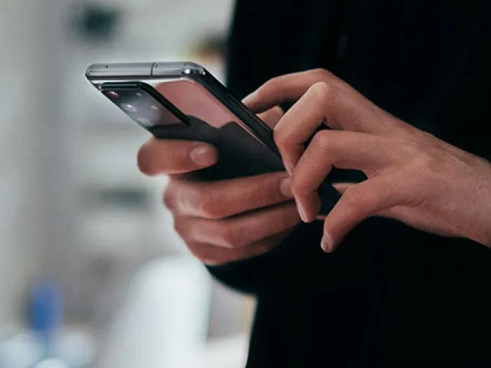 close up of person using a cell phone