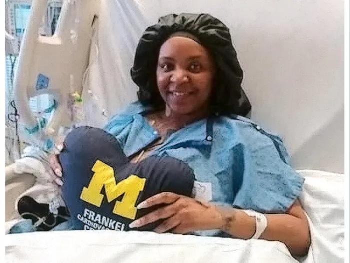 woman smiling hospital bed UM pillow