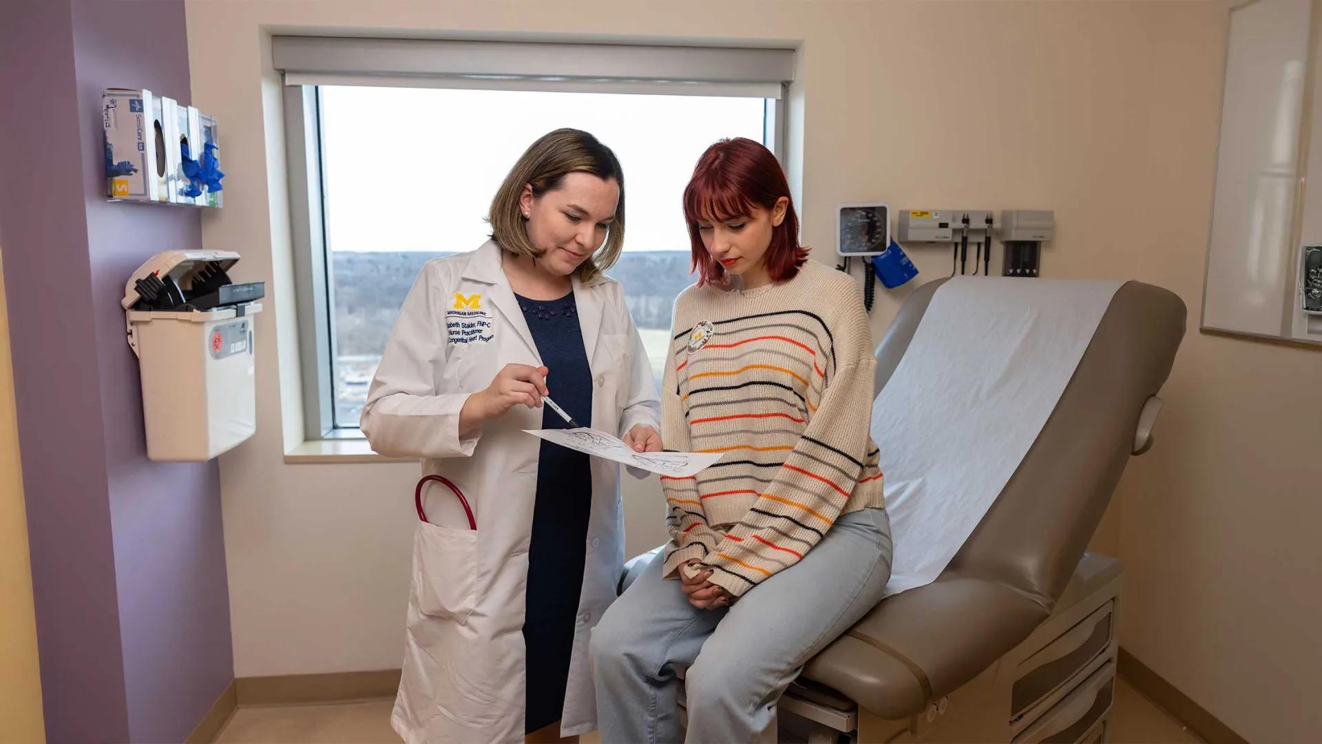 A doctor meets with a patient in CHC 