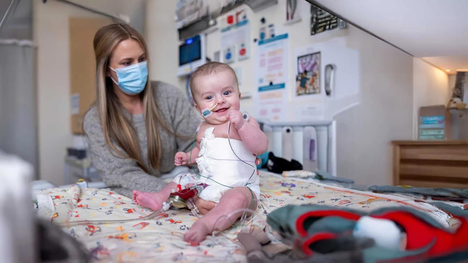 Baby smiles after heart transplant