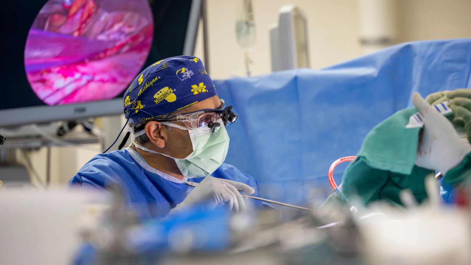 Male surgeon operates on heart in the OR