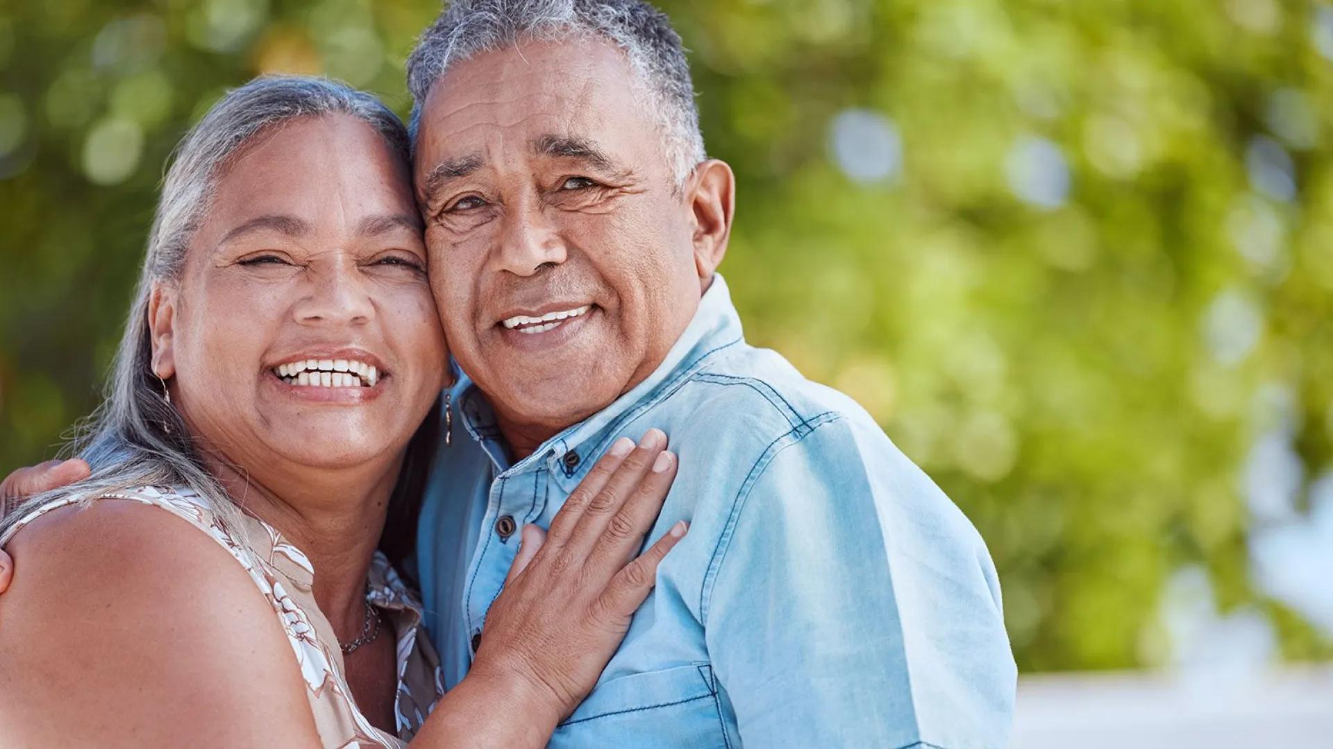 smiling man and woman hugging