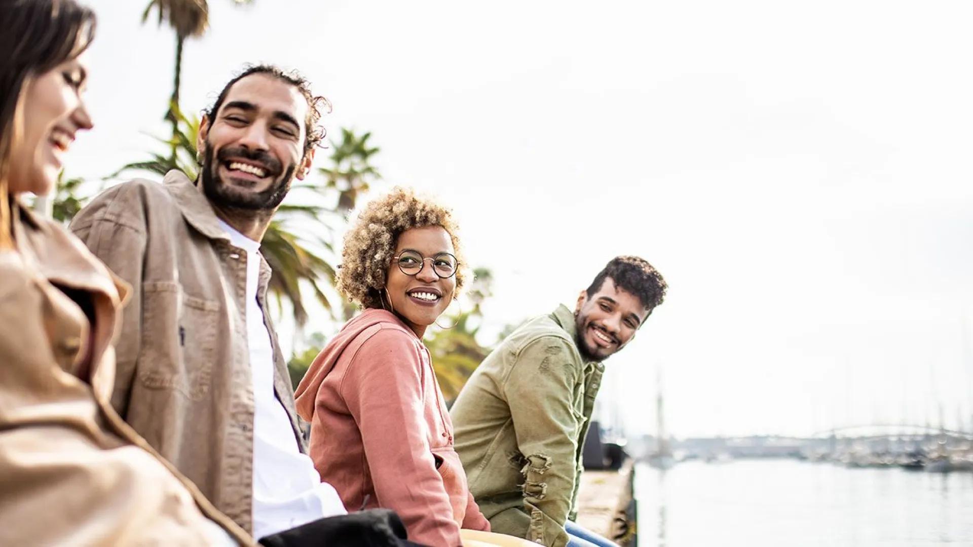 group smiling near the bay