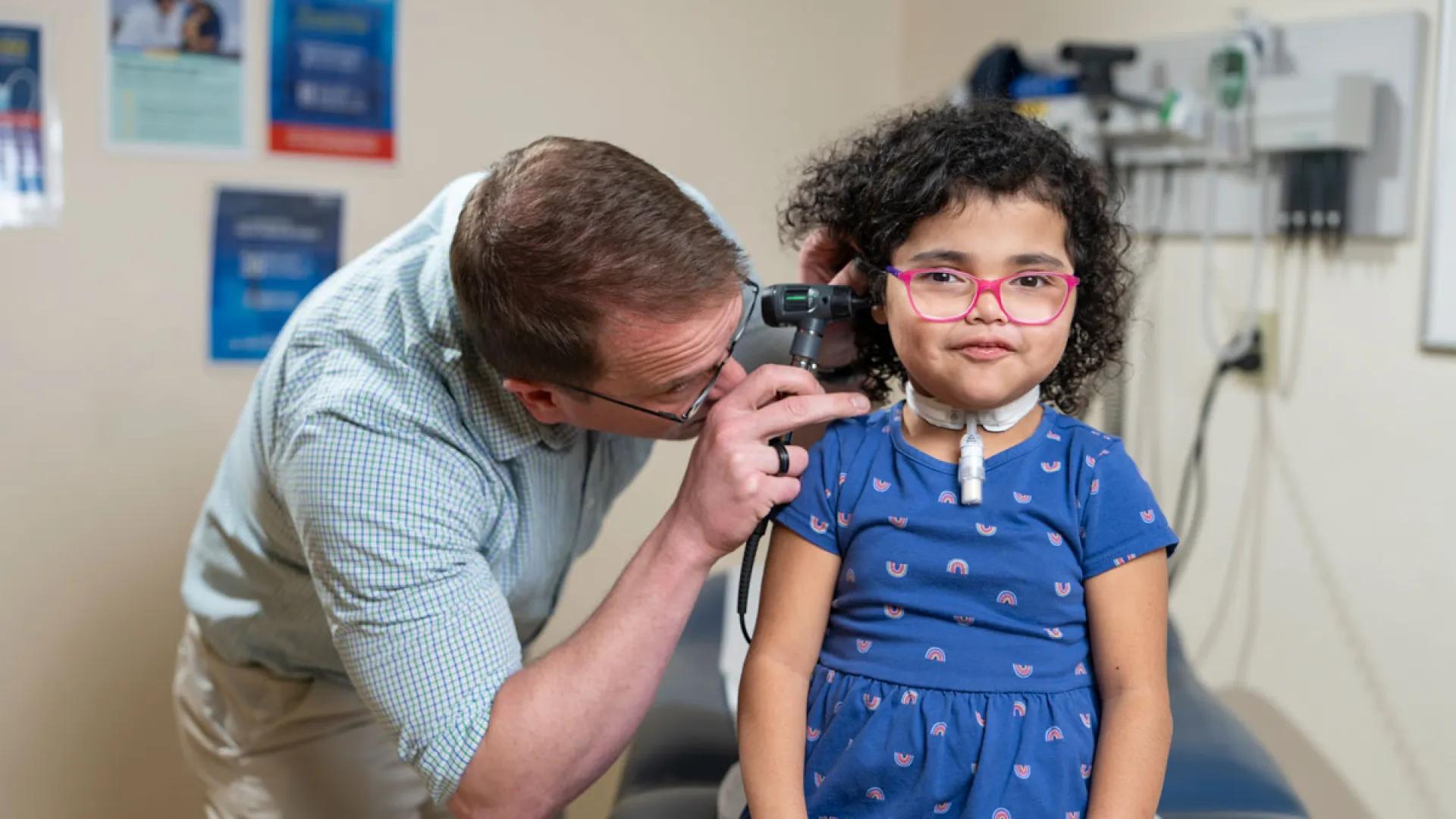Doctor examines young Rosalina's inner ear