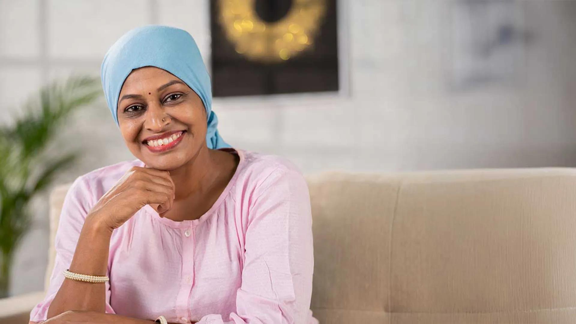 Woman in pink shit smiling at camera