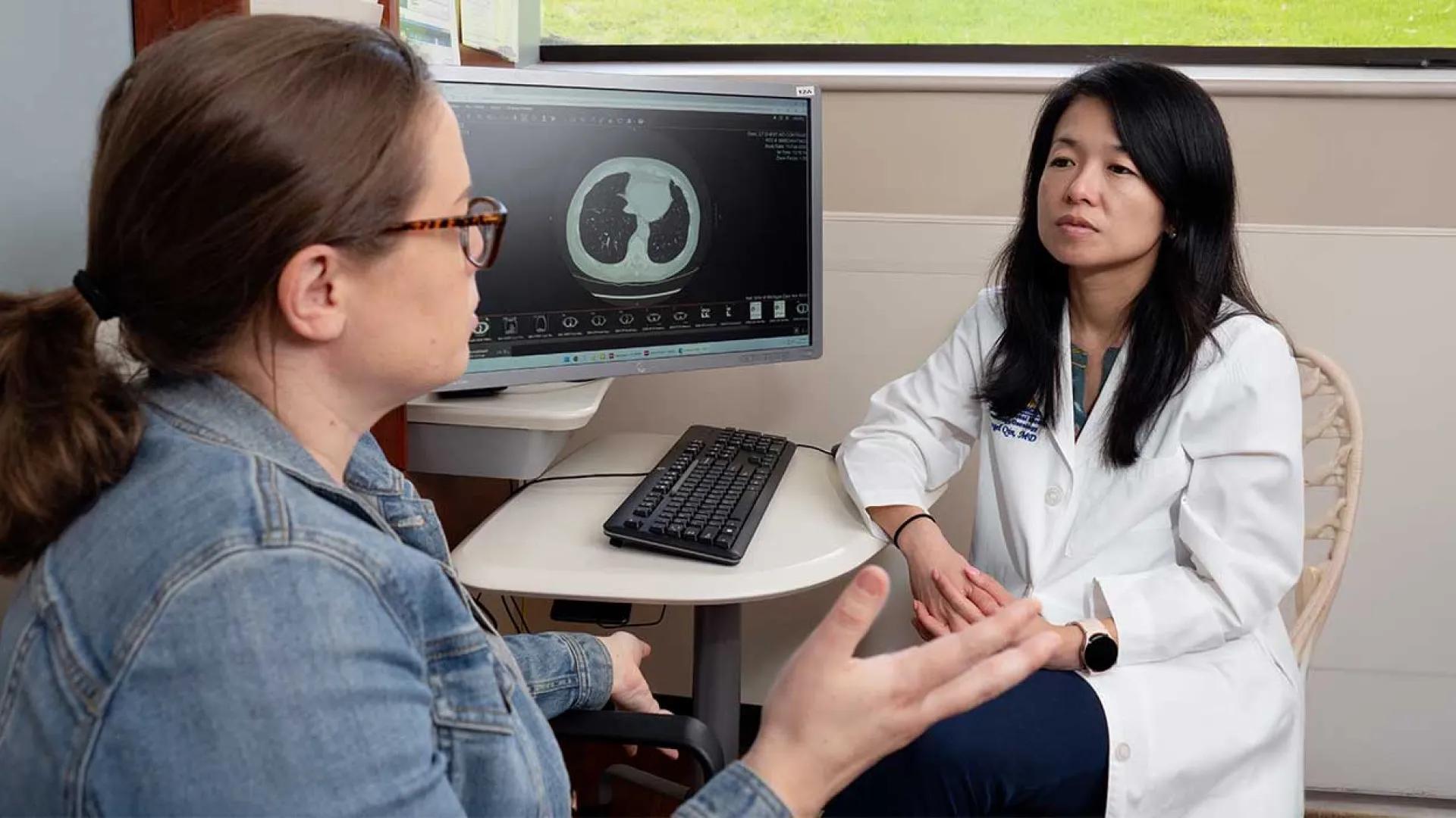 Dr. Angel Qin discusses treatment options with patient
