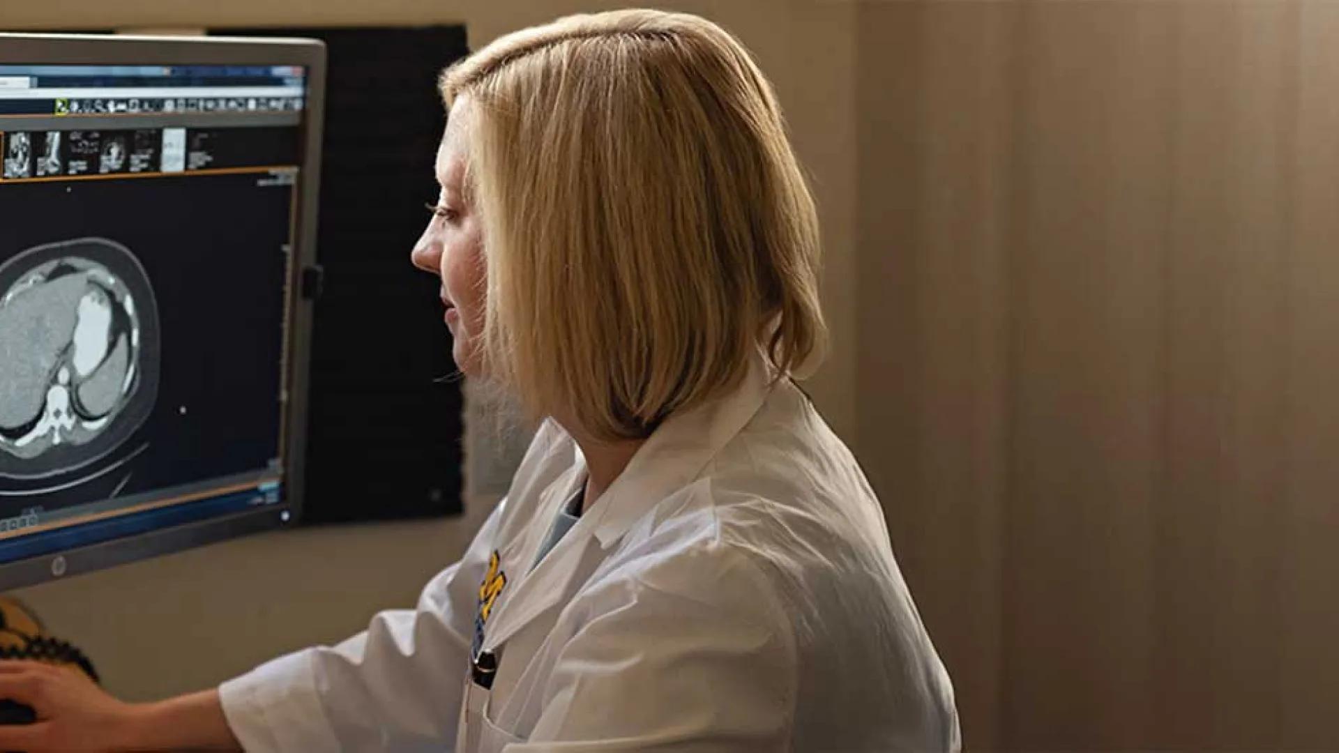 Dr. Erin Cobain looks at an MRI of a breast