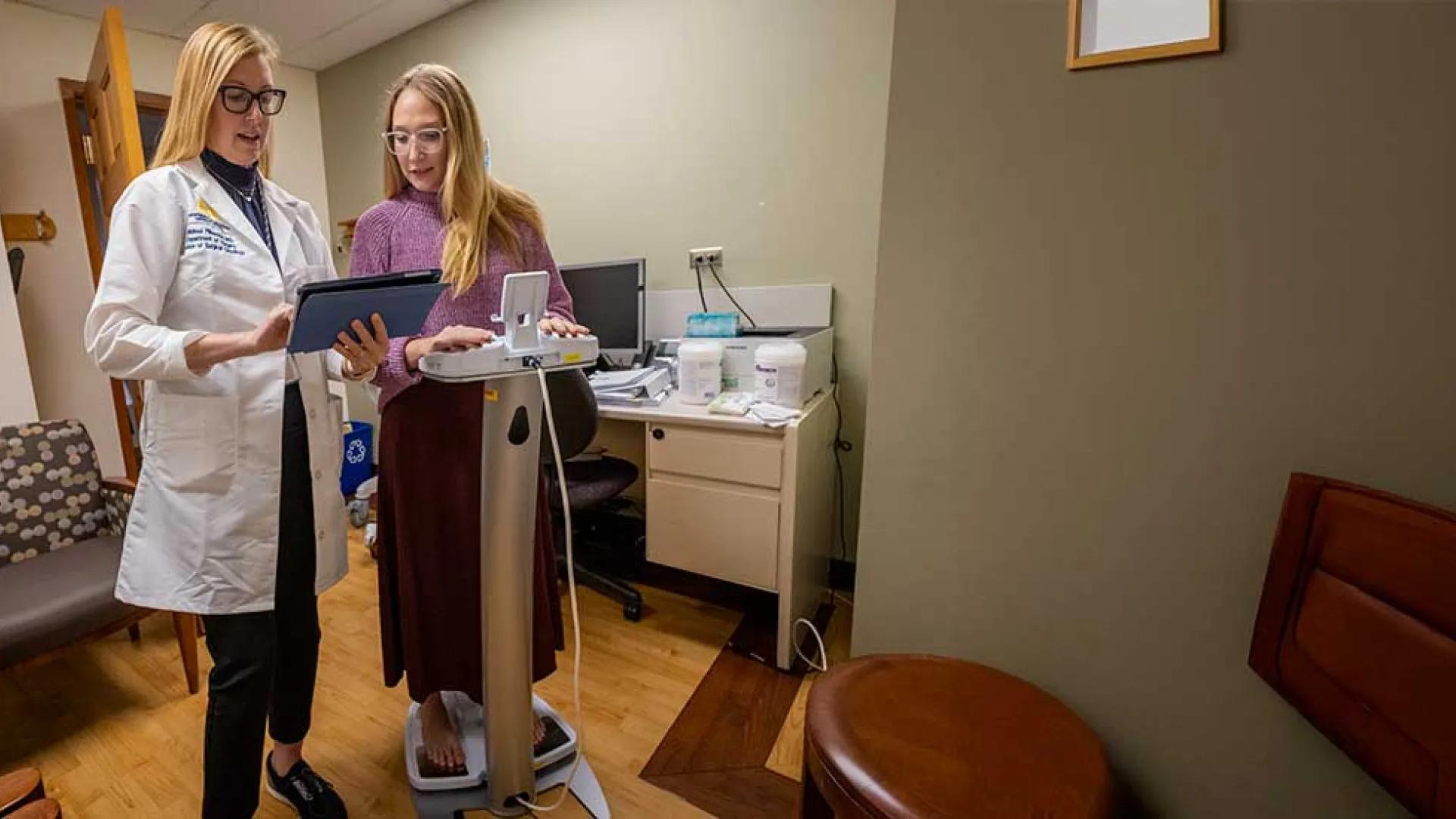 Dr. Melissa Pilewski evaluates a patient for lymphedema