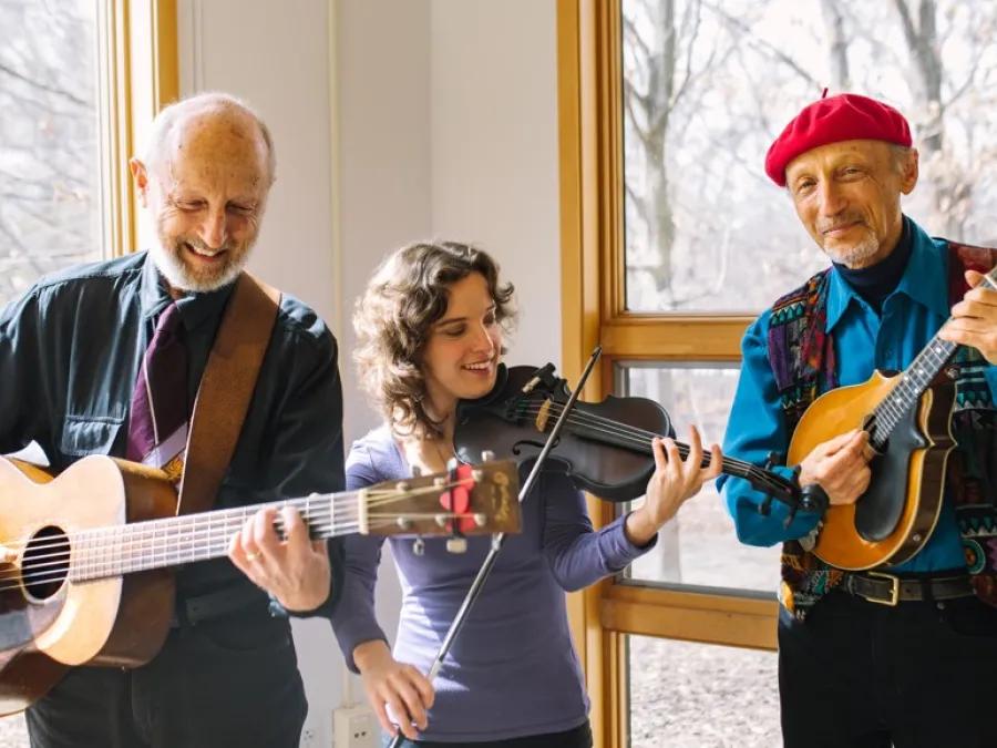 Gemily members pose for a photo with their string instruments