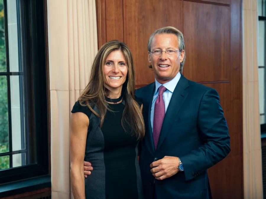 Portrait of Catherine and Nathan Forbes standing inside near a window