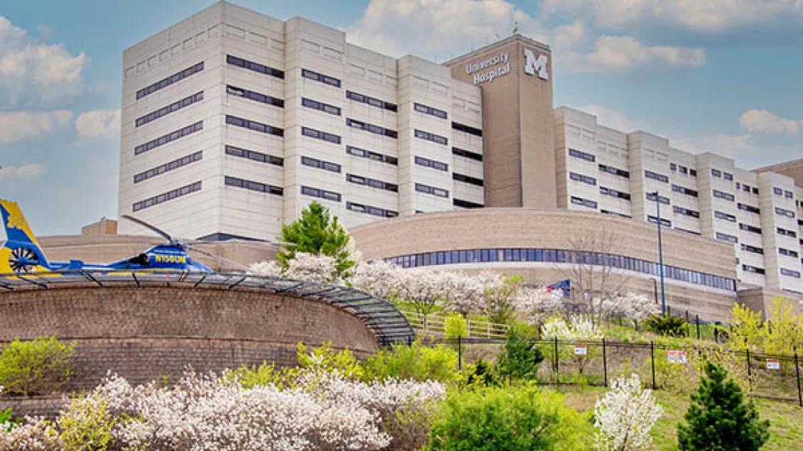 University Hospital at University of Michigan Health in the springtime with Survival flight helicopter in foreground
