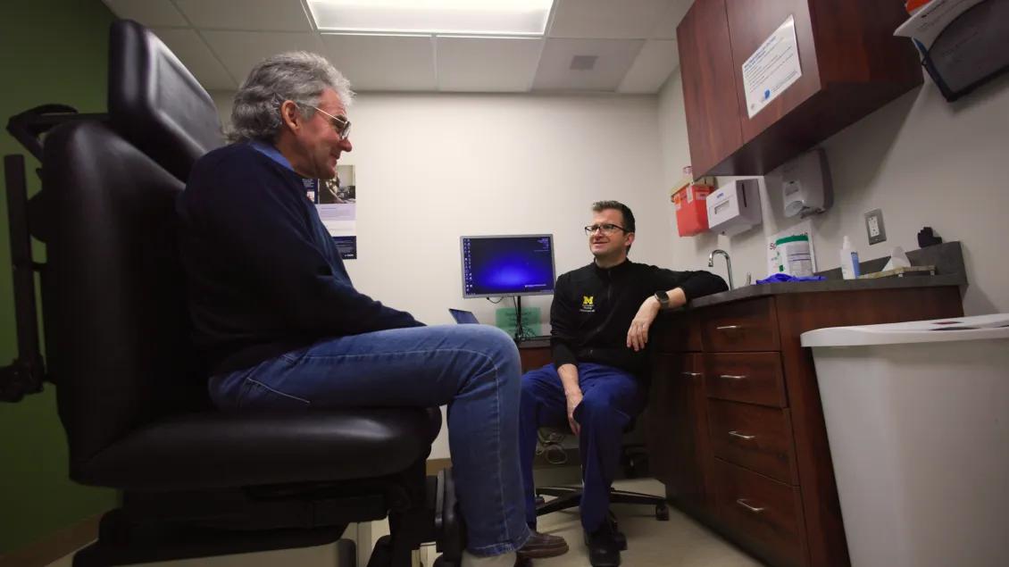 patient talking to doctor in doctor's office
