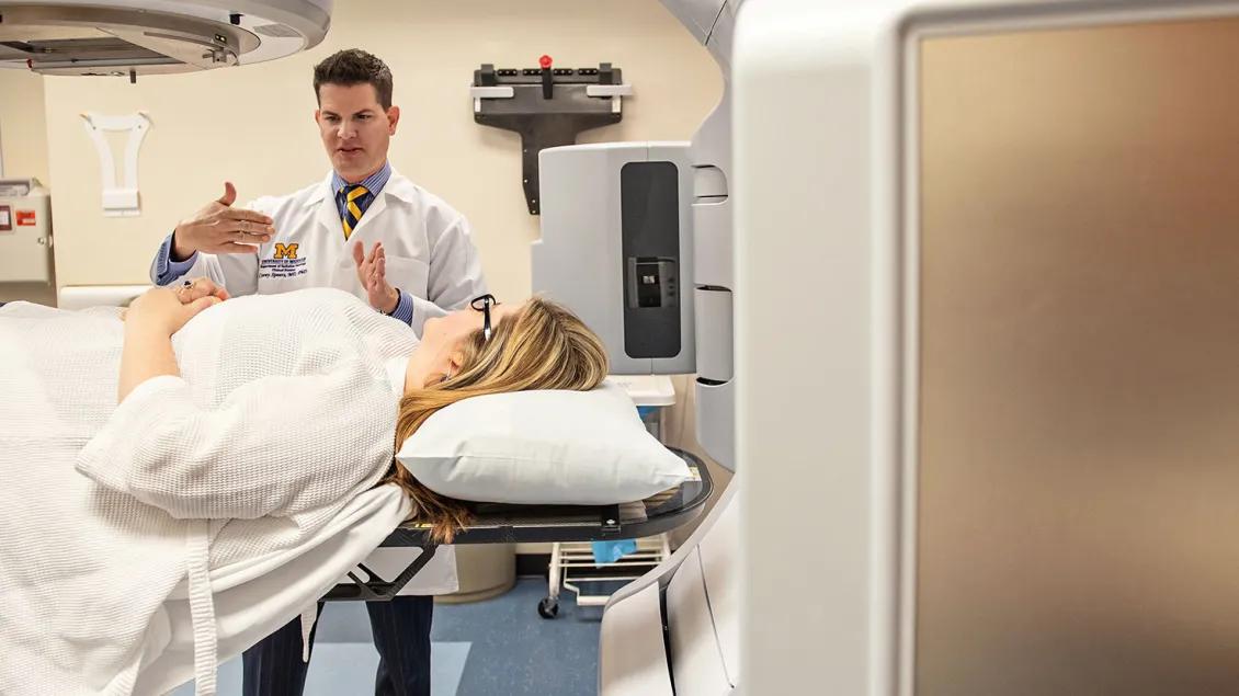 Radiation oncologist with a patient