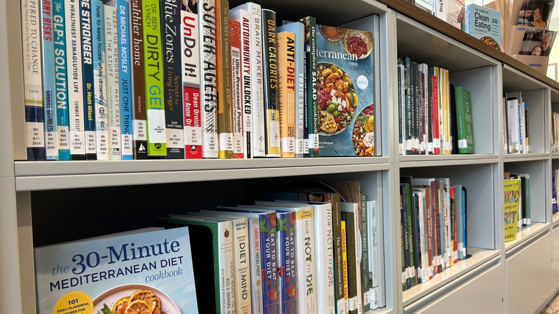 Closeup of two shelves of nutrition and dieting books