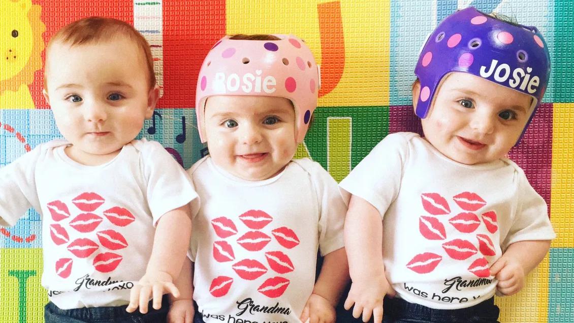 three triplets and two with head gear on with their names in pink and purple